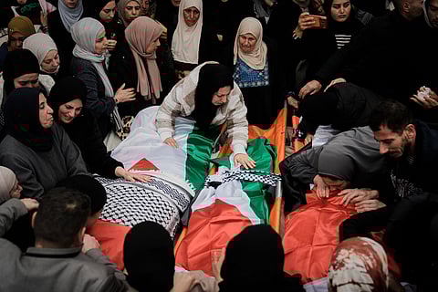 Palestinians mourn at the funeral of four members of the Odeh family who were killed in their car by Israeli security forces during an army operation in Tammun, West Bank, Sunday, March 15, 2026. (AP Photo/Majdi Mohammed)
