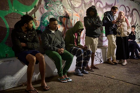People take shelter in an Underground tunnel as air raid sirens signal a warning of incoming Iranian missiles in Jerusalem, Thursday, March 19, 2026.