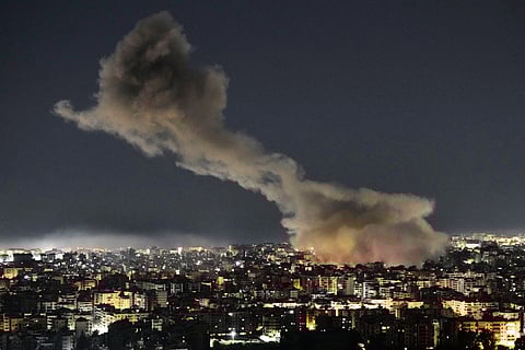 Smoke rises from Israeli airstrikes that struck a building housing Al-Manar channel studios in Dahiyeh, a southern suburb of Beirut, Lebanon, early on Tuesday, March 3, 2026.