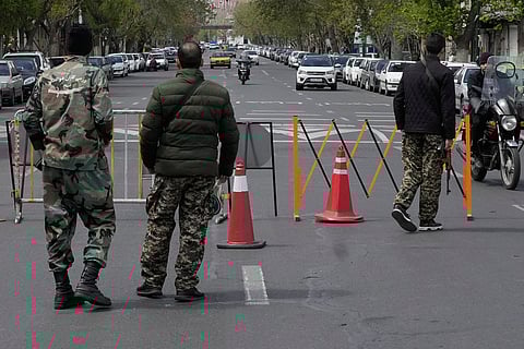 Members of the Basij paramilitary force stand at a checkpoint in Tehran, Iran, Sunday, March 29, 2026.