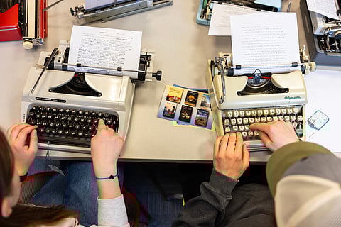 Student use typewriters to complete a writing assignment in German at Cornell University, Friday, March 20, 2026, in Ithaca, N.Y. The professor, Grit Matthias Phelps, brings out the typewriters once each semester for students to disconnect from technology and connect with the assignment in a different way.
