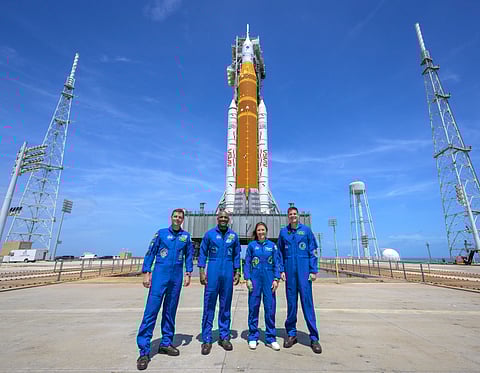 This photo provided by NASA shows NASA astronauts Reid Wiseman, Artemis II commander, from left, Victor Glover, Artemis II pilot, Christina Koch, Artemis II mission specialist, and CSA (Canadian Space Agency) astronaut Jeremy Hansen, Artemis II mission specialist, right, in a group photograph as they visit NASA's Artemis II SLS (Space Launch System) rocket and Orion spacecraft, Monday, March 30, 2026, at Launch Complex 39B of NASA's Kennedy Space Center, in Cape Canaveral, Fla.