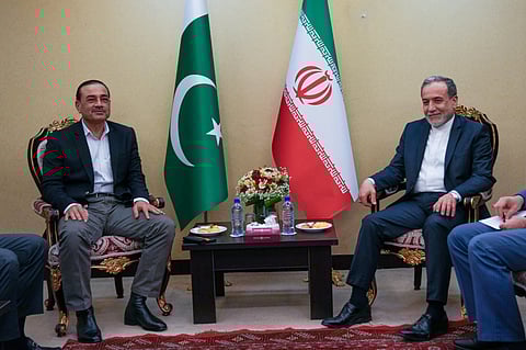In this photo released by the Iranian Foreign Ministry, Iranian Foreign Minister Abbas Araghchi, right, meets with Pakistan's Army Chief Field Marshal Gen. Asim Munir in Tehran, Wednesday, April 15, 2026. (Iranian Foreign Ministry via AP)