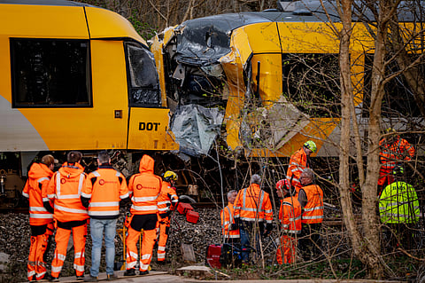 Emergency personnel work at the site where two trains collided near Hilleroed, Denmark, on Thursday, April 23, 2026.