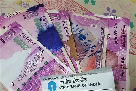 SBI ATM dispenses torn Rs 2,000 notes in Hyderabad, resident files complaint