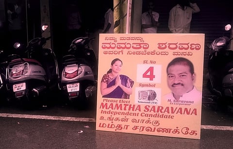 The husband’s photos need to go from women candidate’s election posters