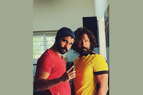 Actor Dhruv Vikram on the left and his father actor Chiyaan Vikram on the right.