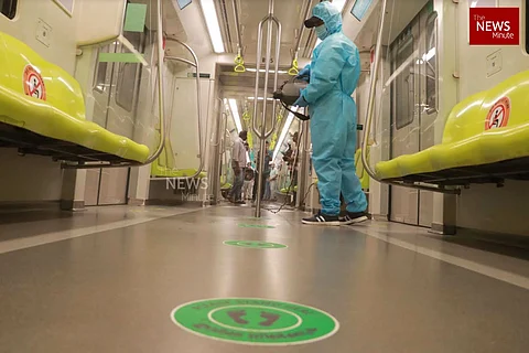 Kochi metro staff sanitising train