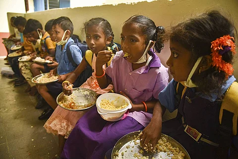 Representative image of students eating mid-day meals
