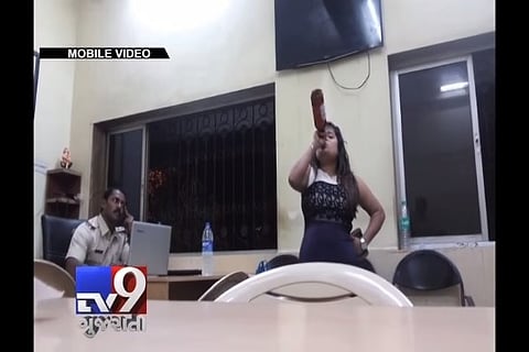 Video: Mumbai woman downs beer inside police station, misbehaves with cops