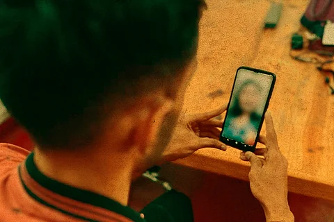Representative image of a man video calling a woman