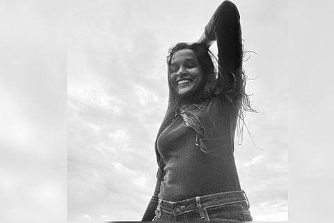 A black and white image of Sneha Belcin