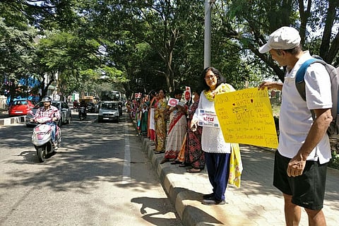 In pictures: Bengalureans form human chain to protest massive steel flyover