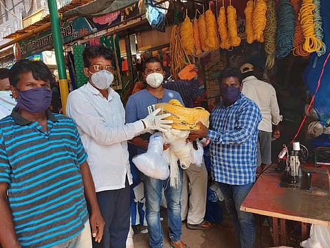 Machilipatnam fisherman family receiving nets as donation