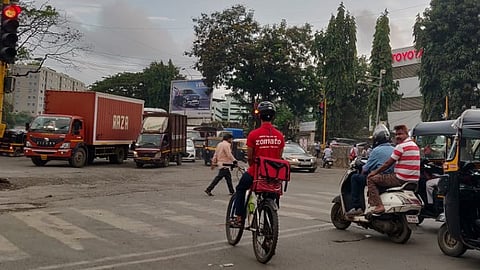 A Zomato delivery person on bicycle