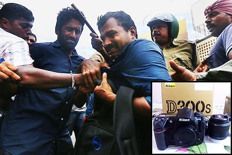 Another protest, another camera broken: But this time the offending party replaced it