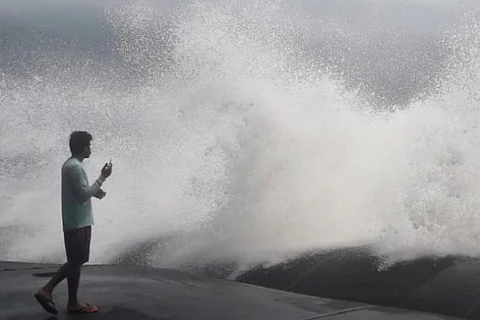 A man standing on the coast of Chellanam in Ernakulam, watching the rough sea during cyclone Tauktae 