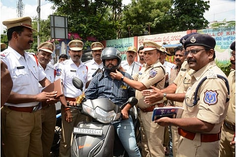 In Hyderabad, cops give helmets instead of challans in unique initiative