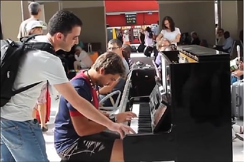Watch: Duo's improv piano performance at airport brings strangers together through music