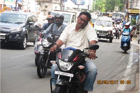 Telangana cops catch man for riding without helmet, realise he faces 135 cases