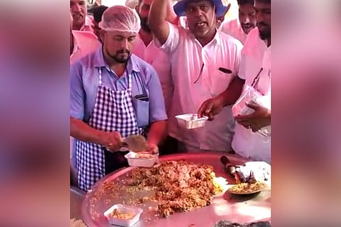 Protesting price hike, Kerala workers cook and distribute onion-less biriyani