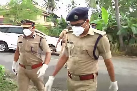 Police personnel on the raid