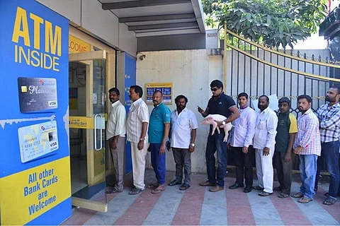 Actor Ravi Babu spotted with a piglet outside Hyderabad ATM