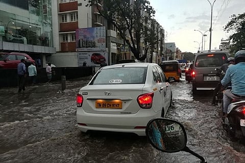 In pictures: Heavy rains bring flooded roads, traffic jams to Chennai