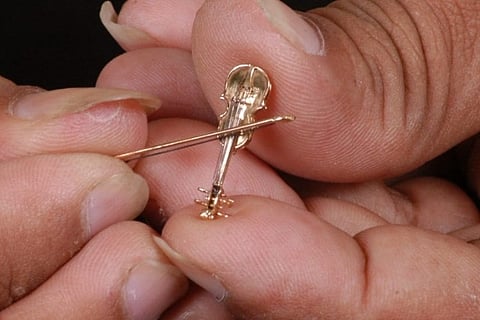 Telangana artist sets record for sculpting smallest functional violin out of gold