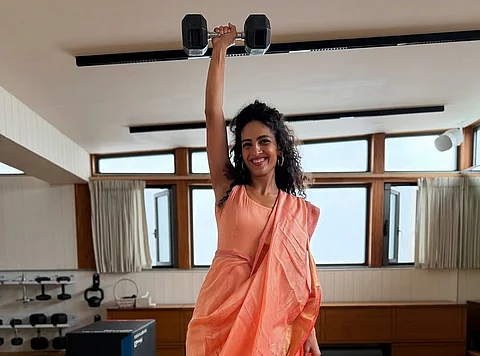 Dancer lifts barbell