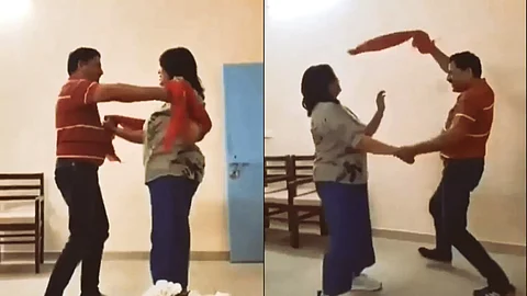 officer dancing with wife