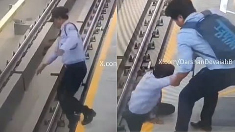 security guard falling onto the metro tracks