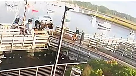 pickup truck falling from a dock