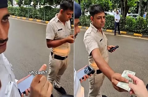 policeman taking Rs 1000 bribe from Japanese tourists
