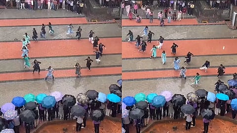 students dancing despite the rain