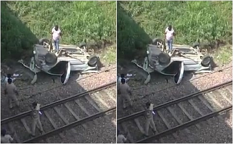 car falling from a flyover onto railway tracks