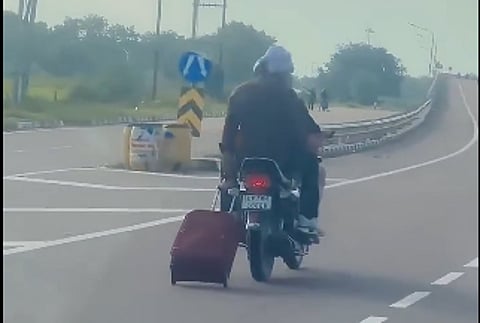 young man carrying his luggage bag