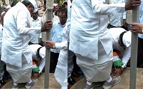 കൈയിൽ ദേശീയ പതാകയുമായി സിദ്ധരാമയ്യയുടെ ഷൂ അഴിച്ചുമാറ്റി കോൺഗ്രസ് പ്രവർത്തകൻ; വിമർശനവുമായി ബിജെപി