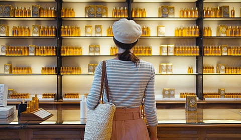 Young girl in a beauty store in Paris, France