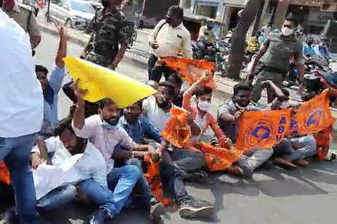 ABVP activists blocking the road holding placards and ABVP flags