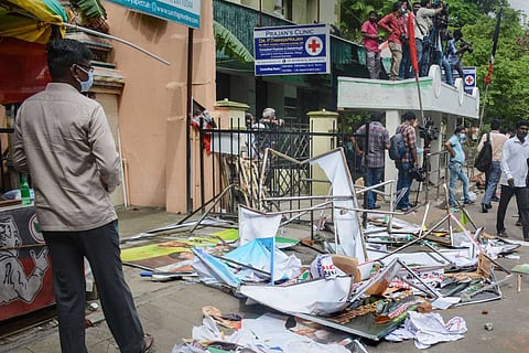Damaged hoardings after two groups of suspected AIADMK workers clashed outside the party headquarters before the general council meeting in Chennai