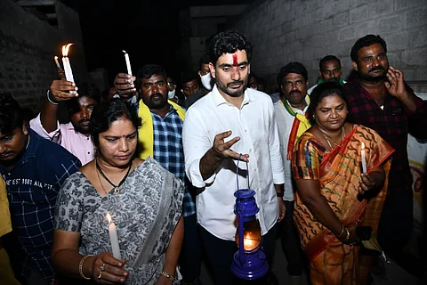 TDP general secretary Nara Lokesh staging a protest with lamps and candles