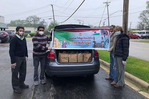 Members of the American Telugu Association distribute essentials amid the coronavirus pandemic