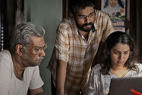 Parvathy Thiruvothu, Biju Menon and Sharaf U Dheen seen in the poster of 'Aarkkariyam'.
