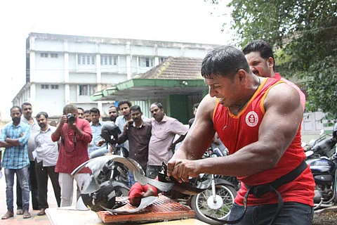 Abheesh breaking a helmet with the force of his wrist