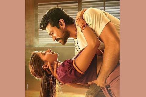 Ram Charan and Pooja Hegde are seen striking a romantic pose in the poster of 'Acharya'.