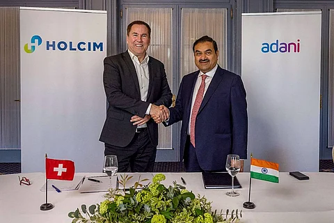 Gautam Adani signing the agreement with Holcim Ltd