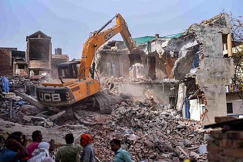 JCBs demolishing the house of Javed Mohammed