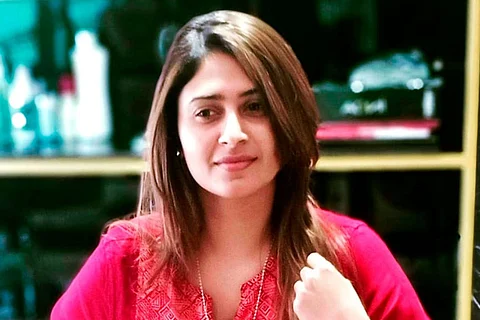 Aisha Sultana in a pink top