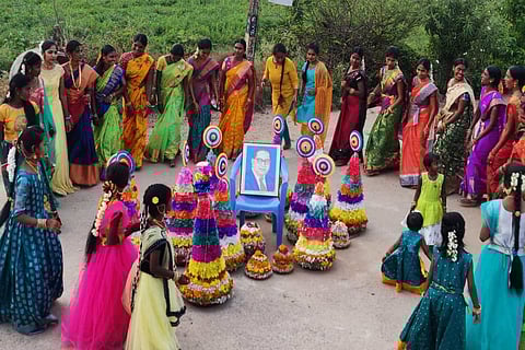 Dalit women celebrating Bathukamma by honoring revolutionary leader Dr BR Ambedkar